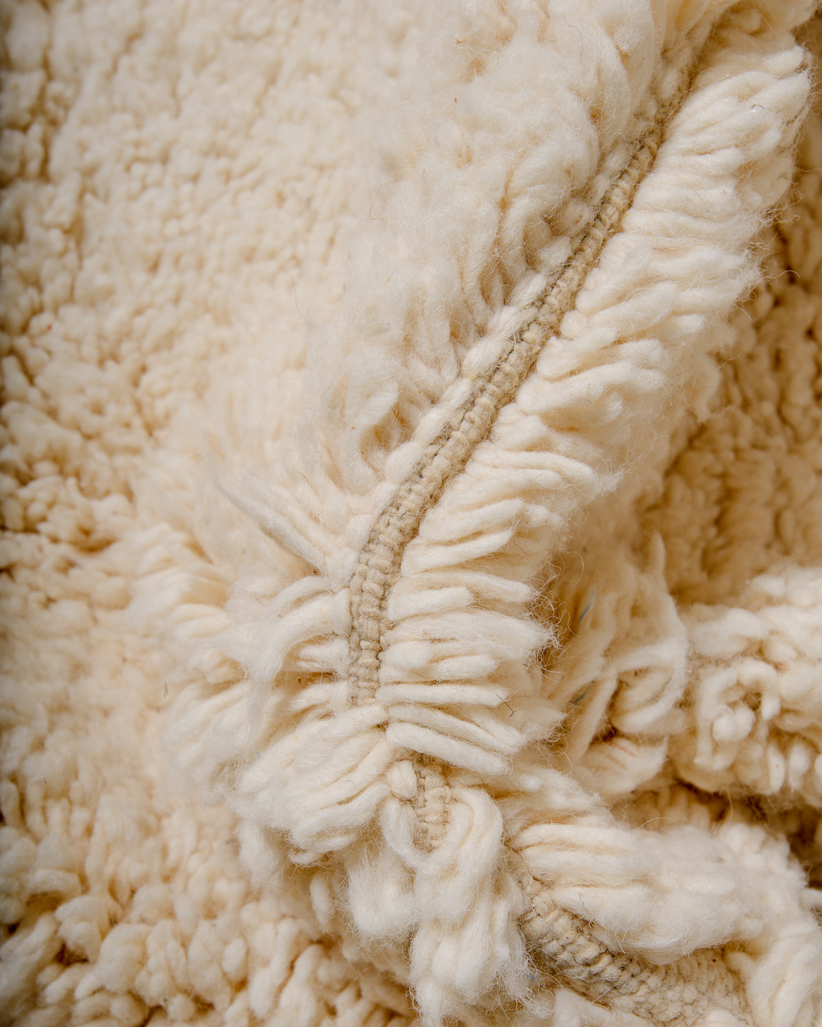 Modern, designer, handcrafted Berber rug from Morocco. Beniourain carpet with minimalist design, natural wool pile and a fluffy texture.