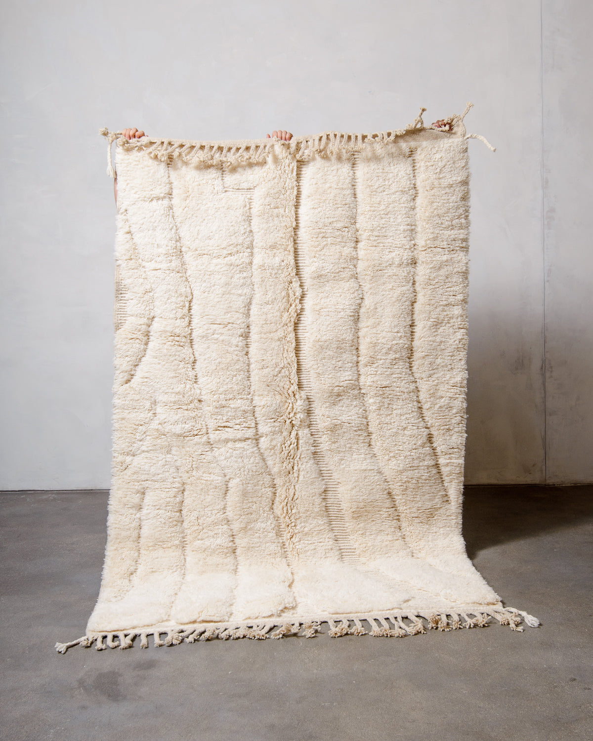 Modern, designer, handcrafted Berber rug from Morocco. Beniourain carpet with minimalist design, natural wool pile and a fluffy texture.