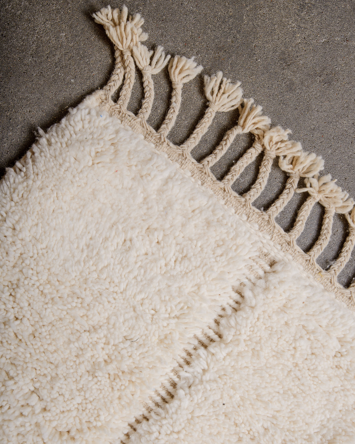 Modern, designer, handcrafted Berber rug from Morocco. Beniourain carpet with minimalist design, natural wool pile and a fluffy texture.