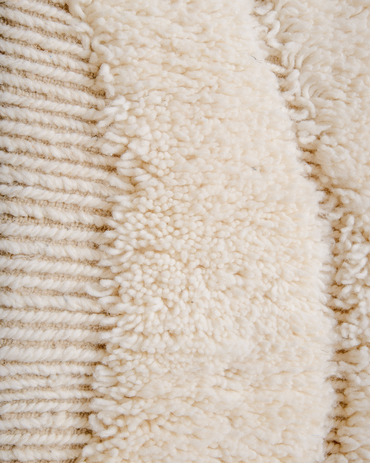 Modern, designer, handcrafted Berber rug from Morocco. Beniourain carpet with minimalist design, natural wool pile and a fluffy texture.