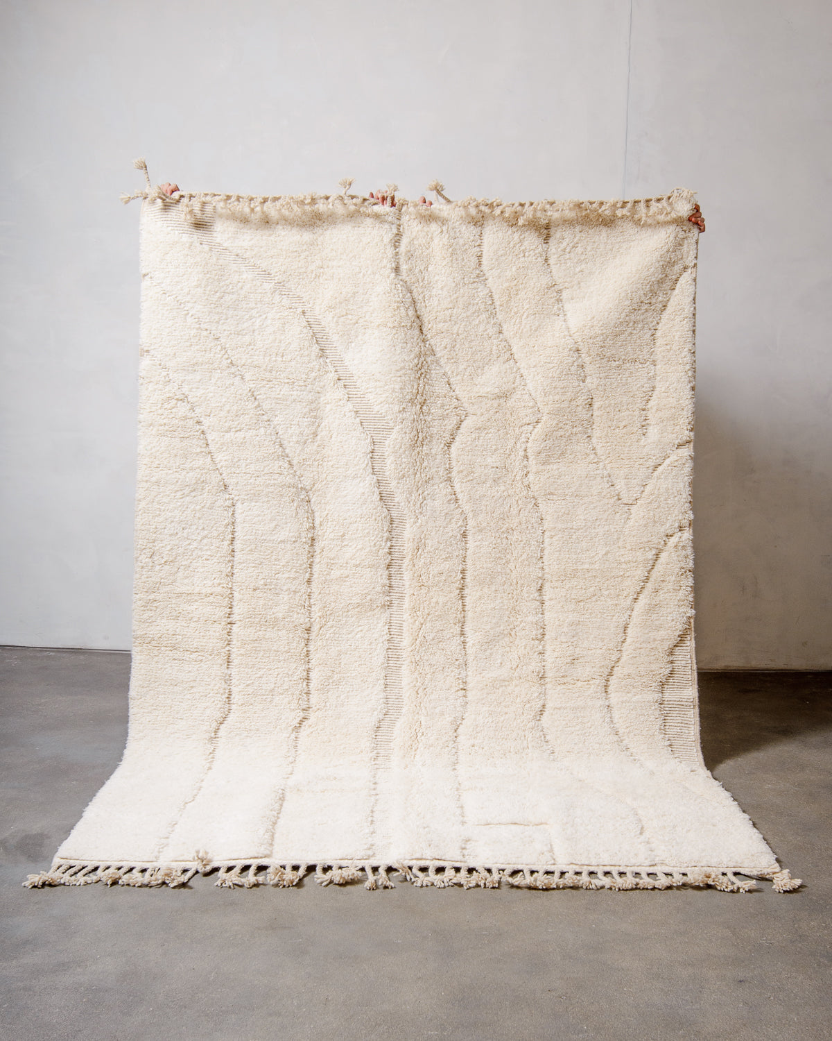 Modern, designer, handcrafted Berber rug from Morocco. Beniourain carpet with minimalist design, natural wool pile and a fluffy texture.