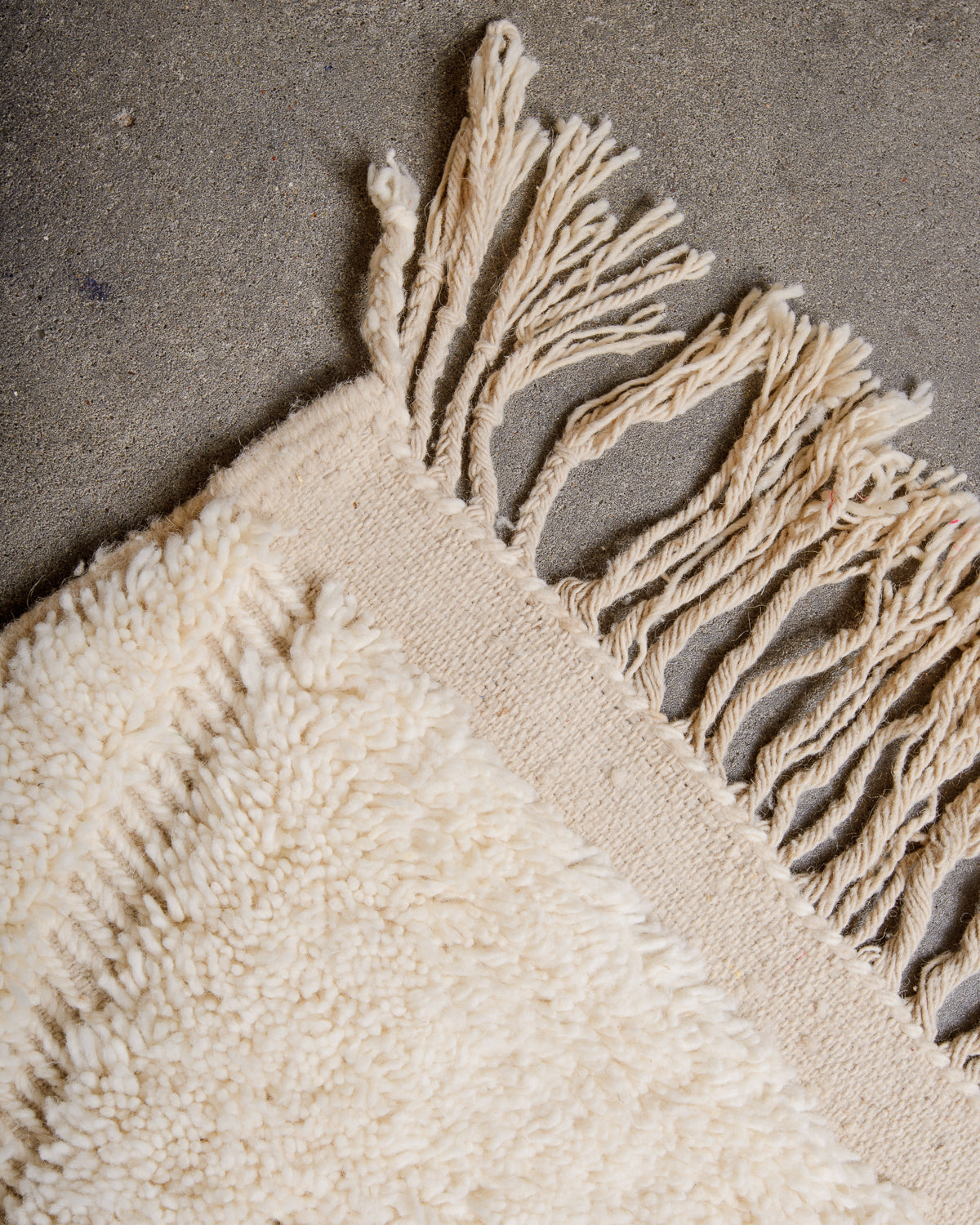 Modern, designer, handcrafted Berber rug from Morocco. Beniourain carpet with minimalist design, natural wool pile and a fluffy texture.