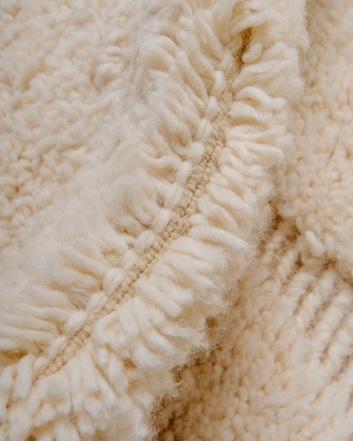 Modern, designer, handcrafted Berber rug from Morocco. Beniourain carpet with minimalist design, natural wool pile and a fluffy texture.