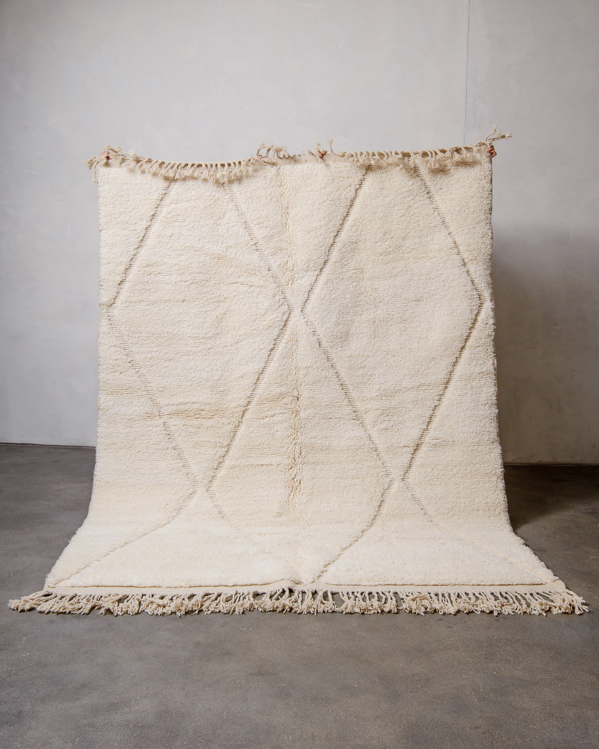 Modern, designer, handcrafted Berber rug from Morocco. Beniourain carpet with minimalist design, natural wool pile and a fluffy texture.