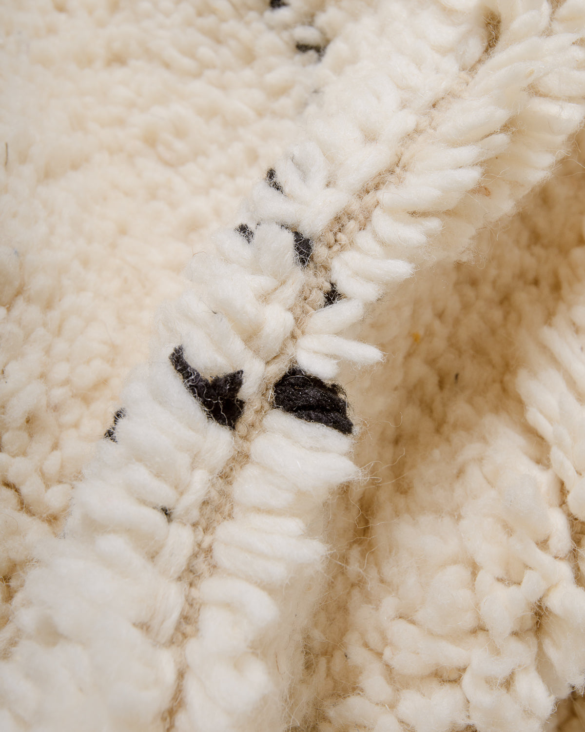 Modern, designer, handcrafted Berber rug from Morocco. Beniourain carpet with minimalist design, natural wool pile and a fluffy texture.