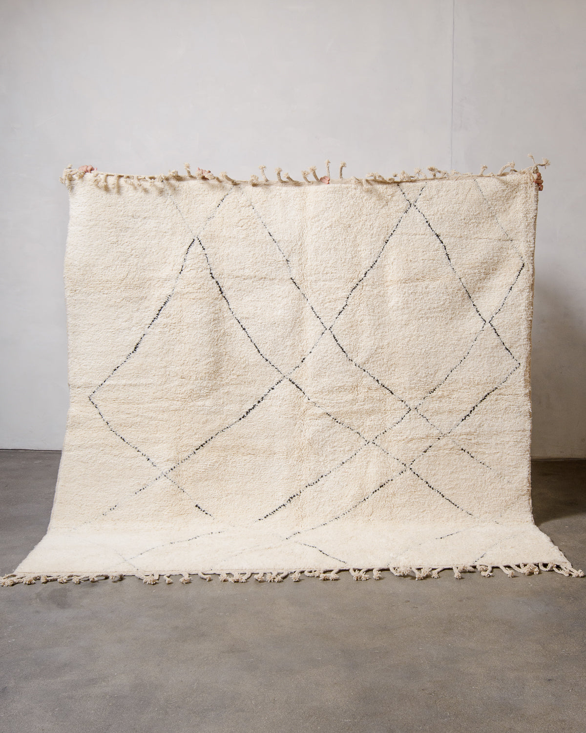 Modern, designer, handcrafted Berber rug from Morocco. Beniourain carpet with minimalist design, natural wool pile and a fluffy texture.