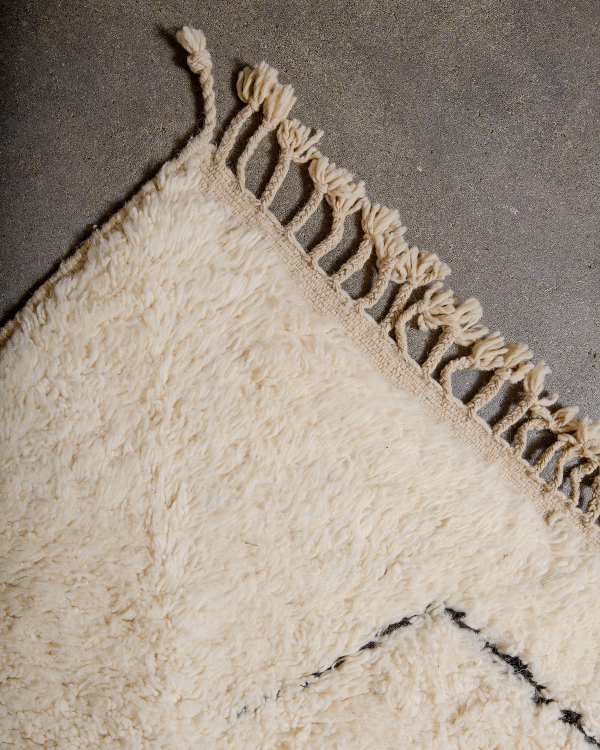 Modern, designer, handcrafted Berber rug from Morocco. Beniourain carpet with minimalist design, natural wool pile and a fluffy texture.
