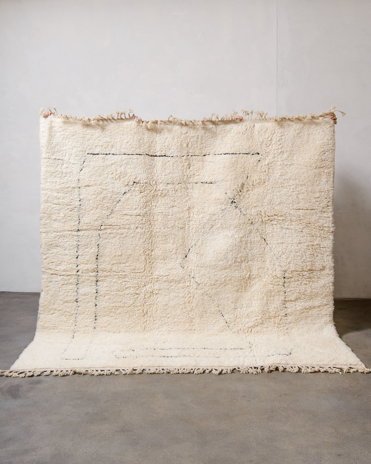 Modern, designer, handcrafted Berber rug from Morocco. Beniourain carpet with minimalist design, natural wool pile and a fluffy texture.