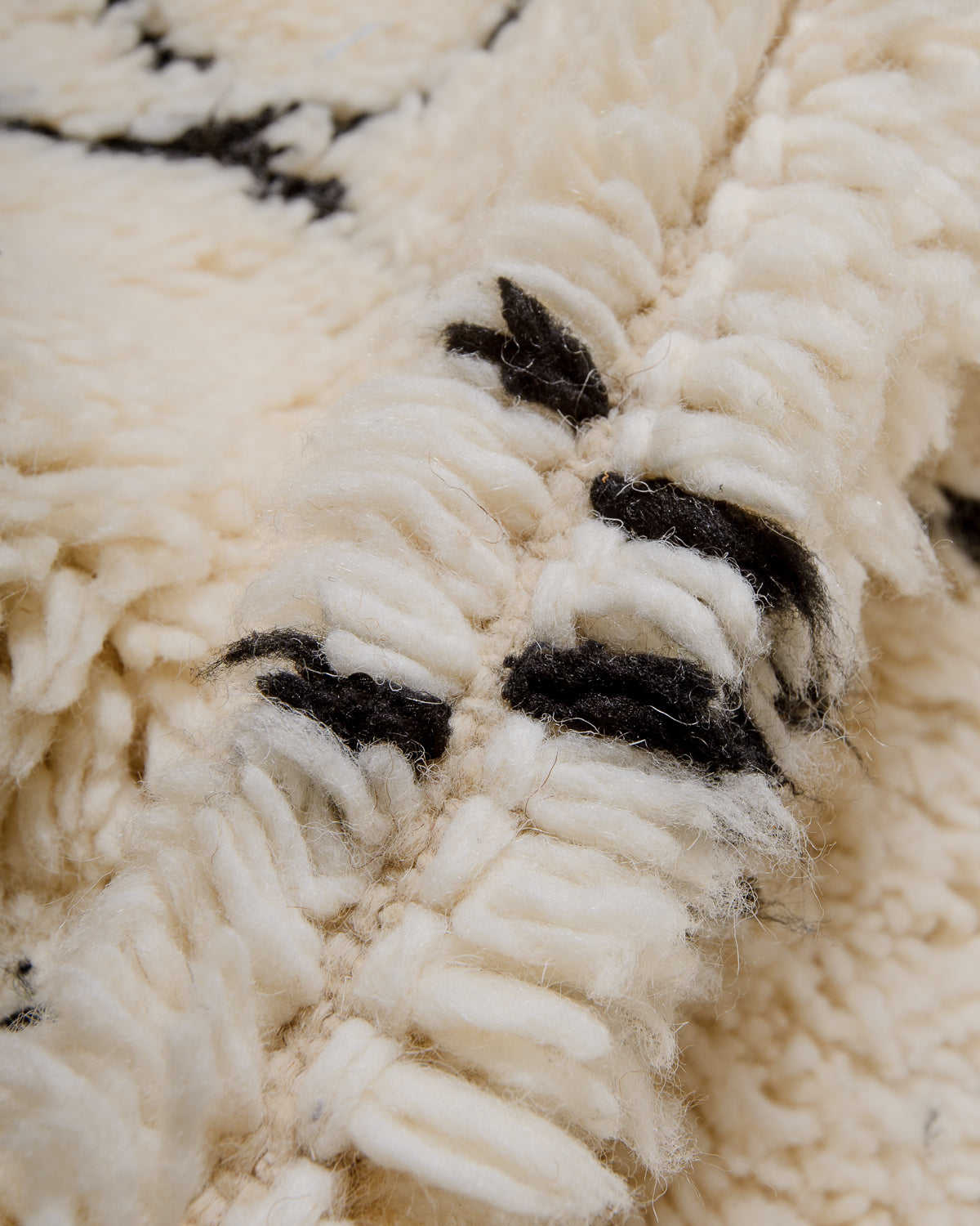 Modern, designer, handcrafted Berber rug from Morocco. Beniourain carpet with minimalist design, natural wool pile and a fluffy texture.