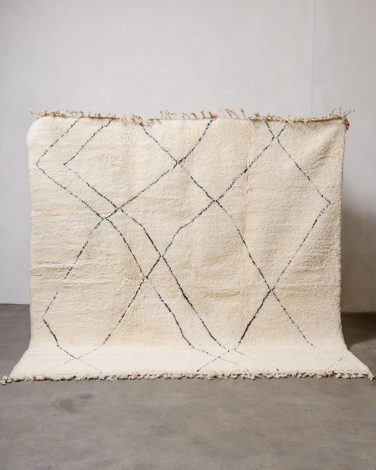 Modern, designer, handcrafted Berber rug from Morocco. Beniourain carpet with minimalist design, natural wool pile and a fluffy texture.