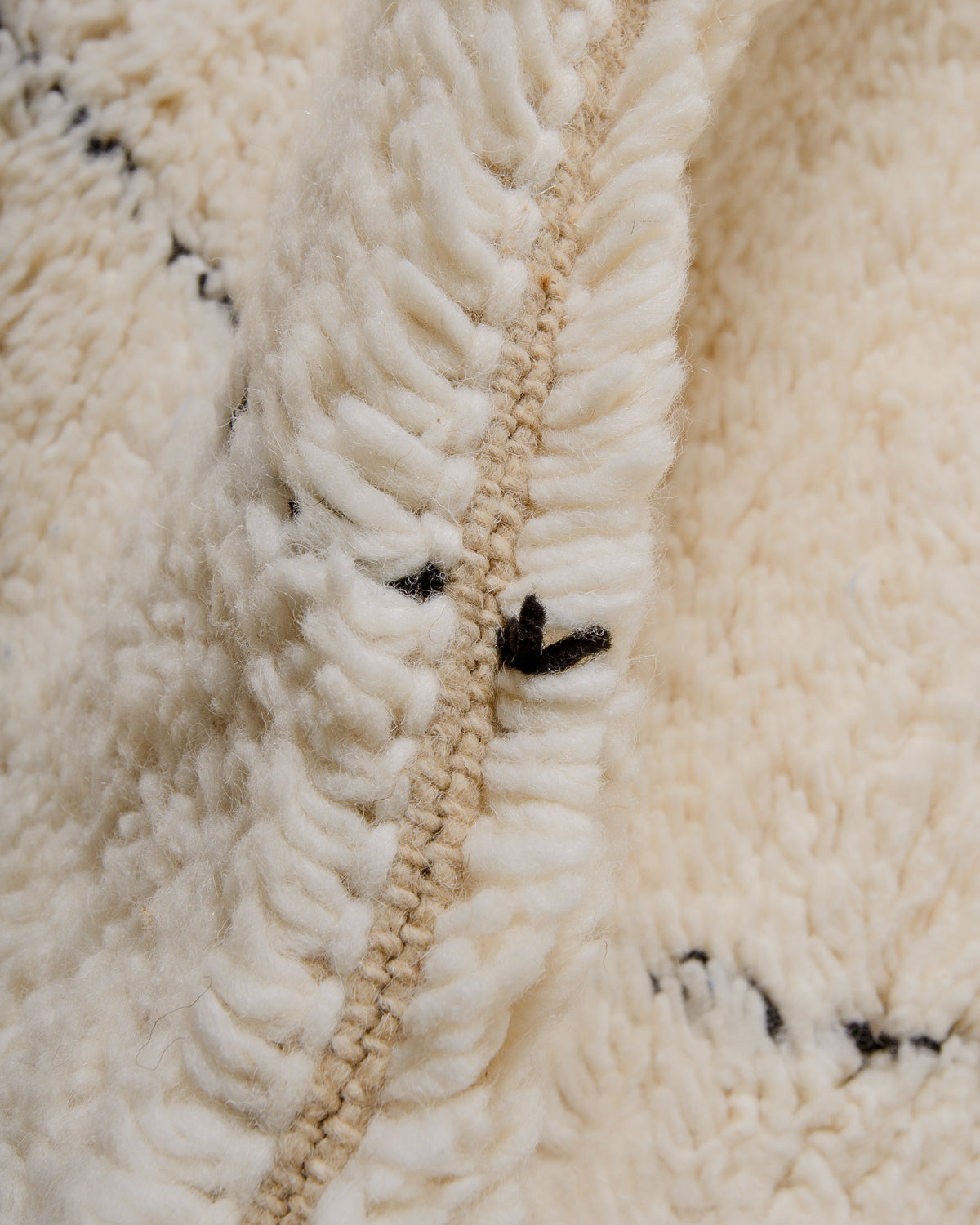 Detail of wool of cream Berber rug.