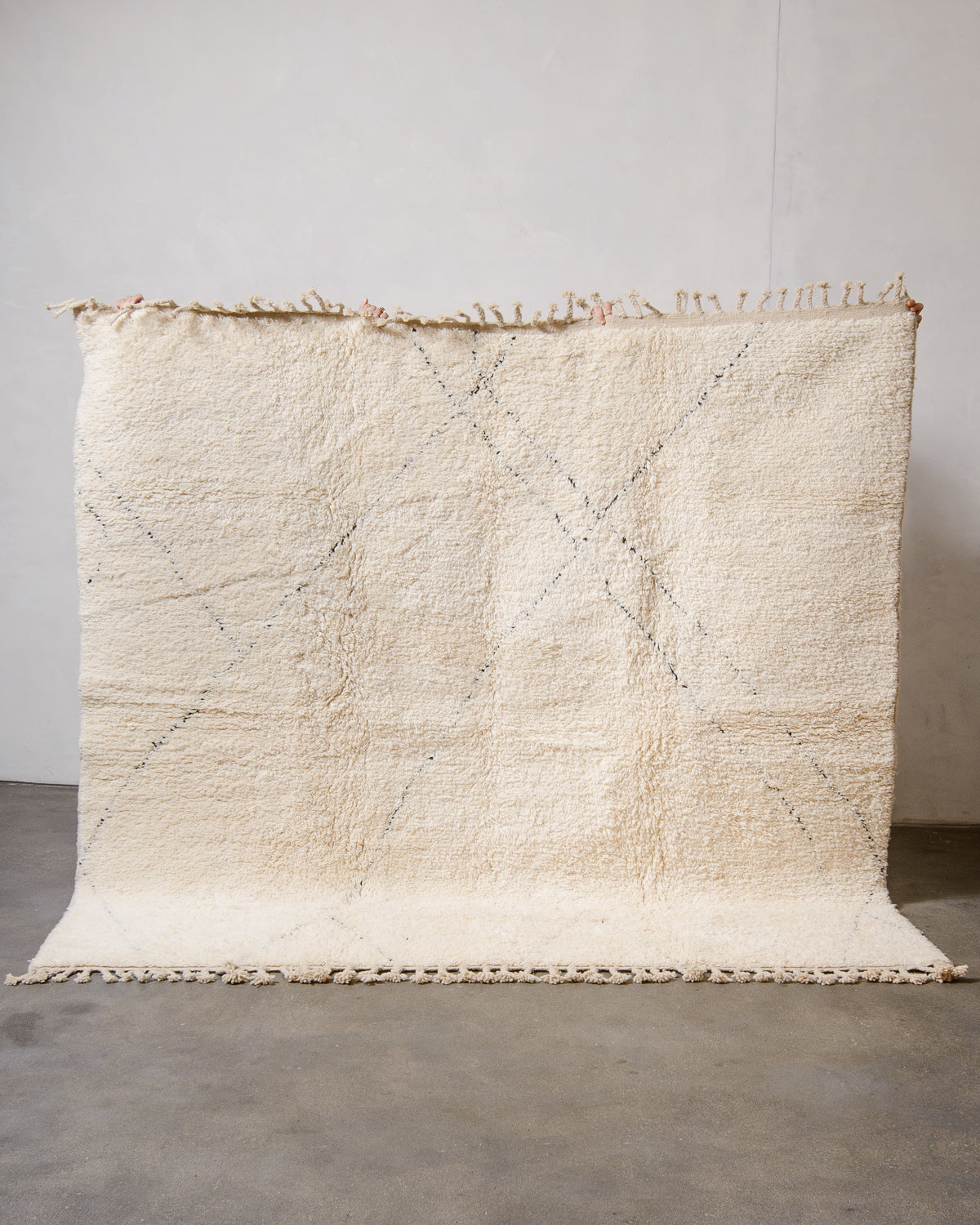 Modern, designer, handcrafted Berber rug from Morocco. Beniourain carpet with minimalist design, natural wool pile and a fluffy texture.