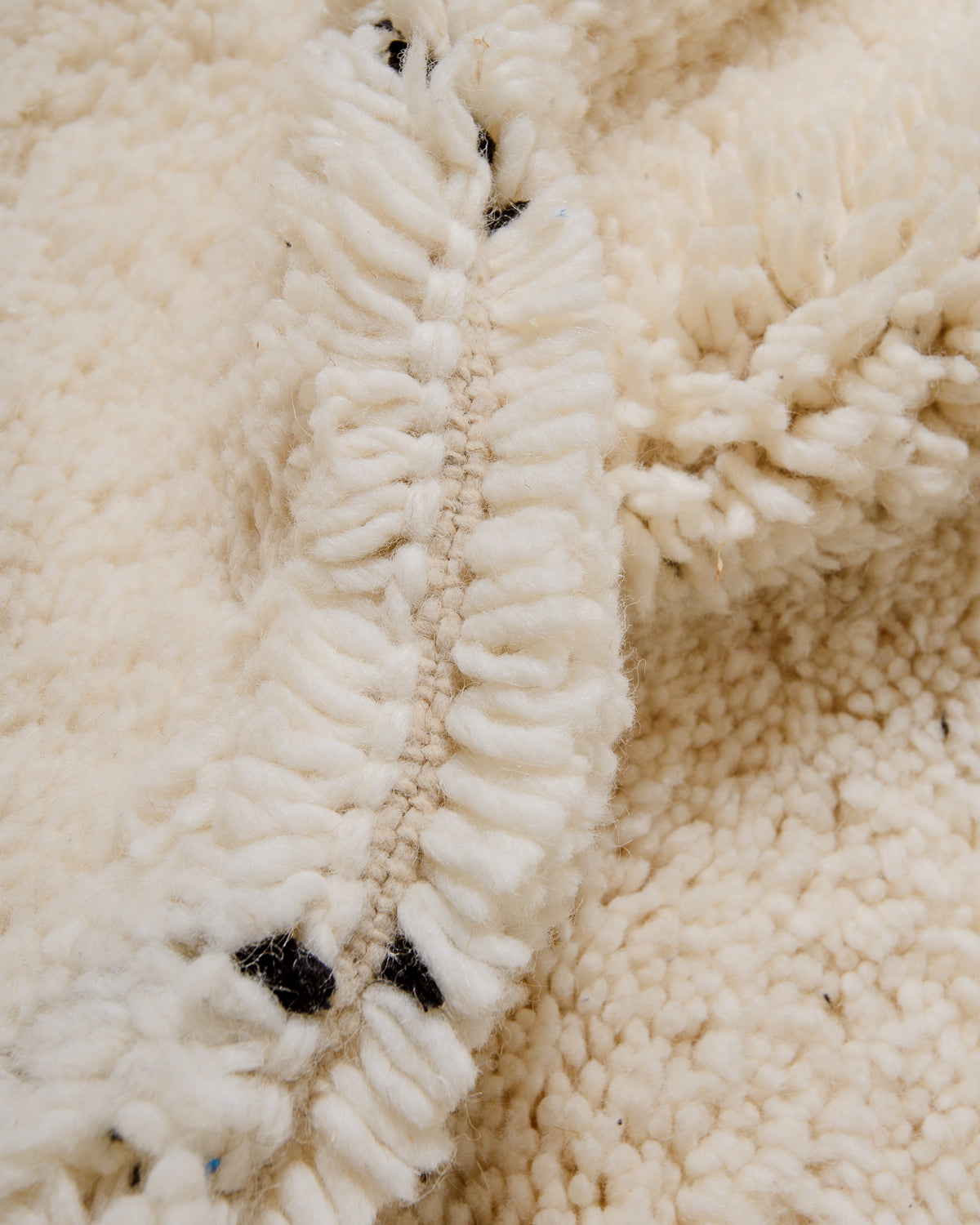 Detail of wool of cream Berber rug.