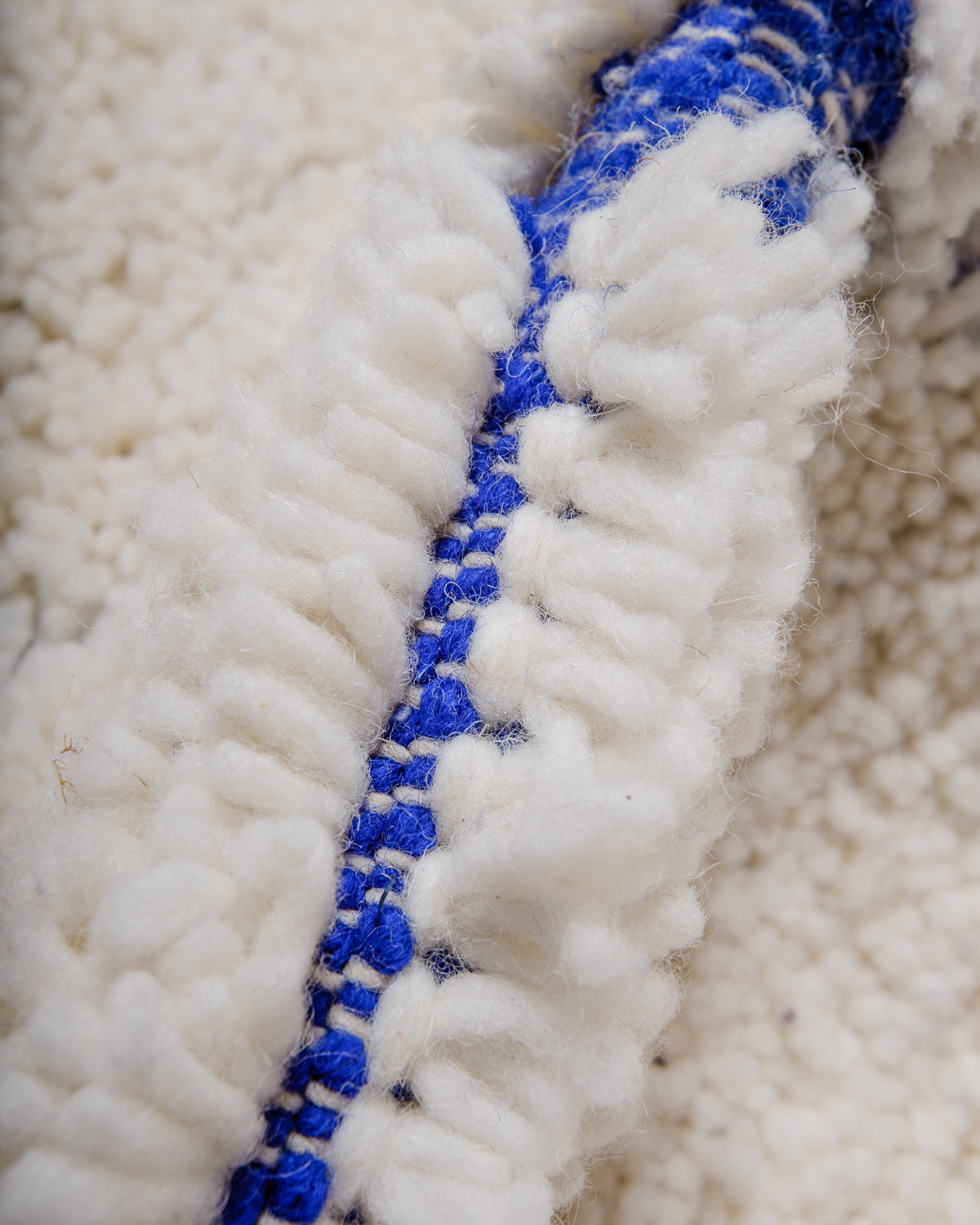 Modern, designer, handcrafted Berber rug from Morocco. Beniourain carpet with minimalist design, natural wool pile and a fluffy texture.