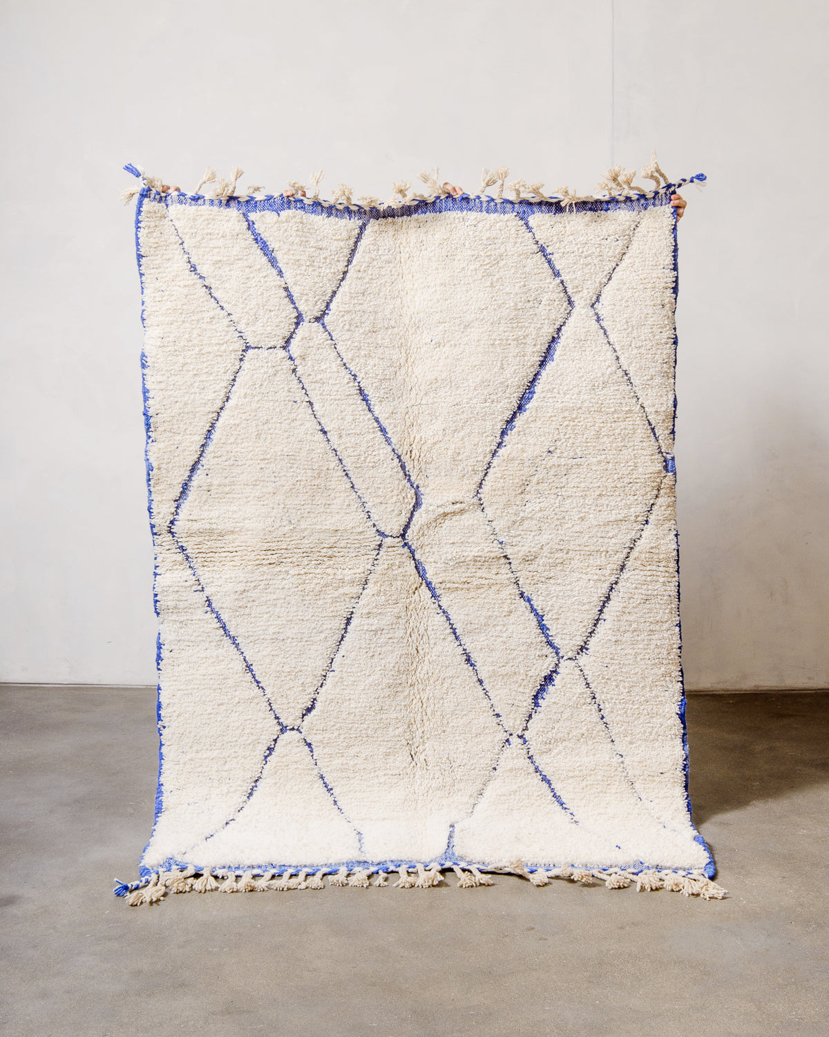 Modern, designer, handcrafted Berber rug from Morocco. Beniourain carpet with minimalist design, natural wool pile and a fluffy texture.