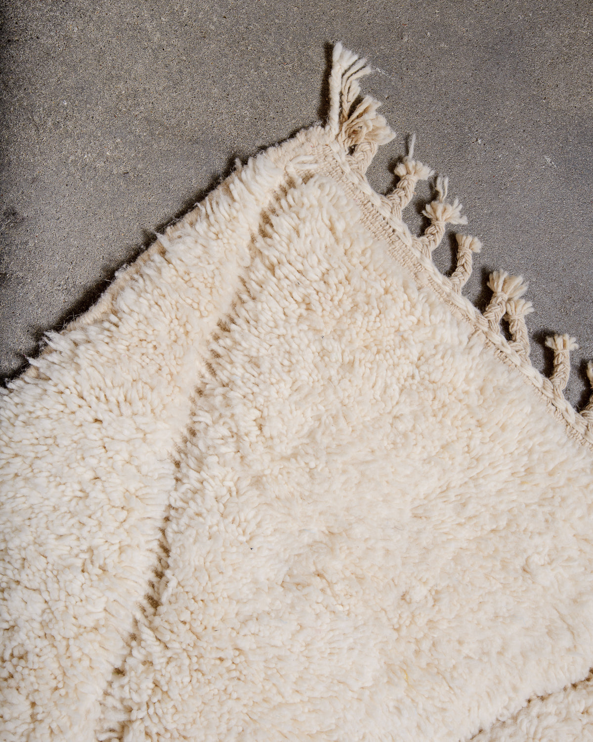 Modern, designer, handcrafted Berber rug from Morocco. Beniourain carpet with minimalist design, natural wool pile and a fluffy texture.