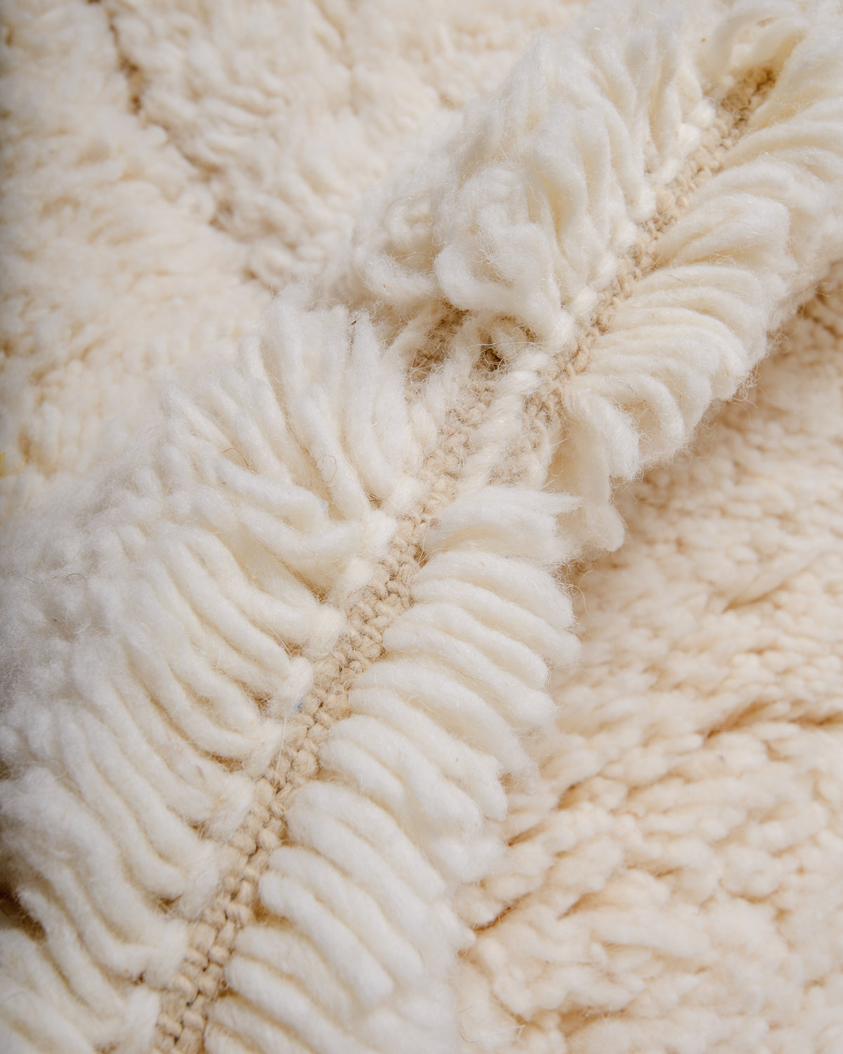 Modern, designer, handcrafted Berber rug from Morocco. Beniourain carpet with minimalist design, natural wool pile and a fluffy texture.