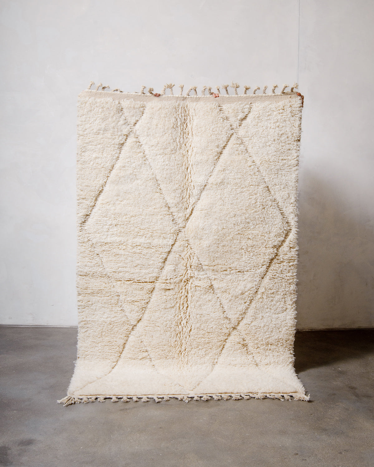 Modern, designer, handcrafted Berber rug from Morocco. Beniourain carpet with minimalist design, natural wool pile and a fluffy texture.