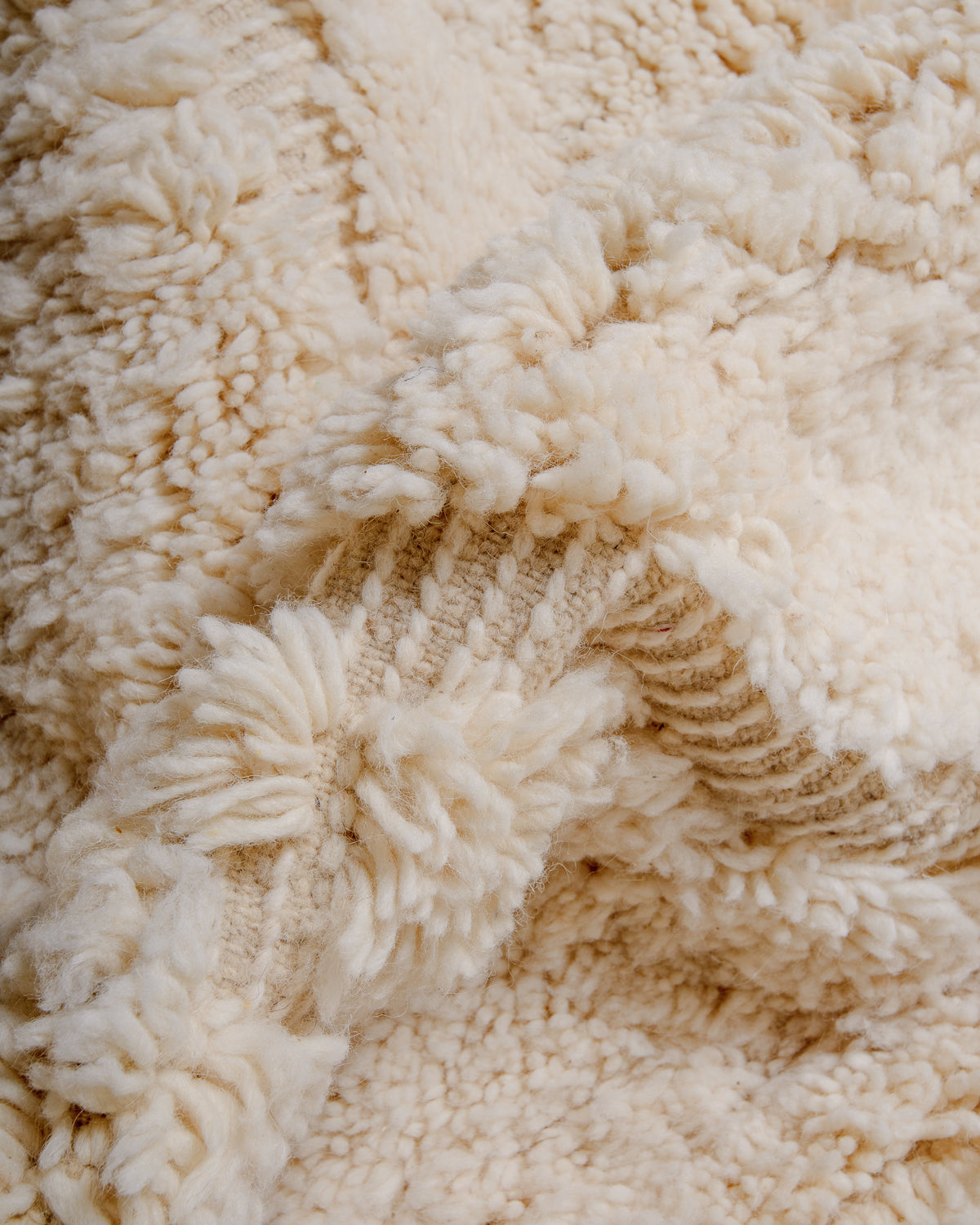 Modern, designer, handcrafted Berber rug from Morocco. Beniourain carpet with minimalist design, natural wool pile and a fluffy texture.