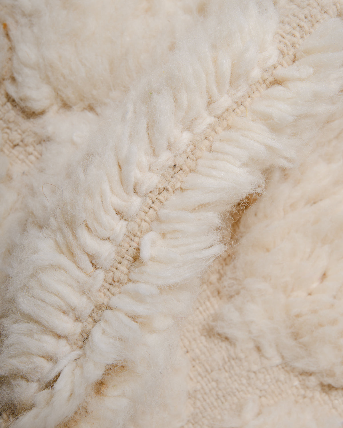 Modern, designer, handcrafted Berber rug from Morocco. Beniourain carpet with minimalist design, natural wool pile and a fluffy texture.