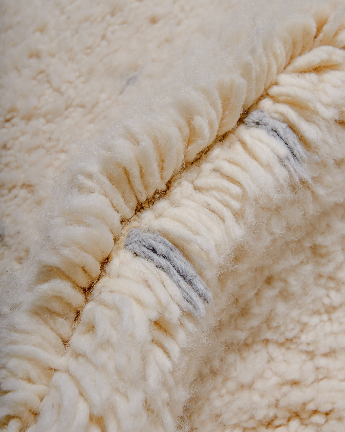 Modern, designer, handcrafted Berber rug from Morocco. Beniourain carpet with minimalist design, natural wool pile and a fluffy texture.