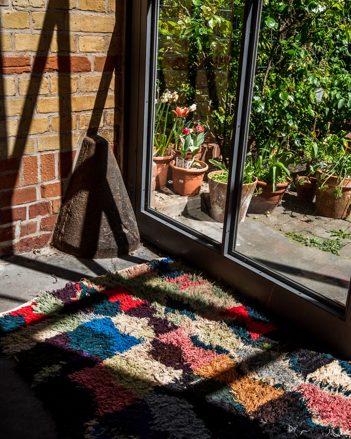 Modern designer vintage handcrafted Berber rug from Morocco. Boucherouite runner rug with beautiful colors and patterns.