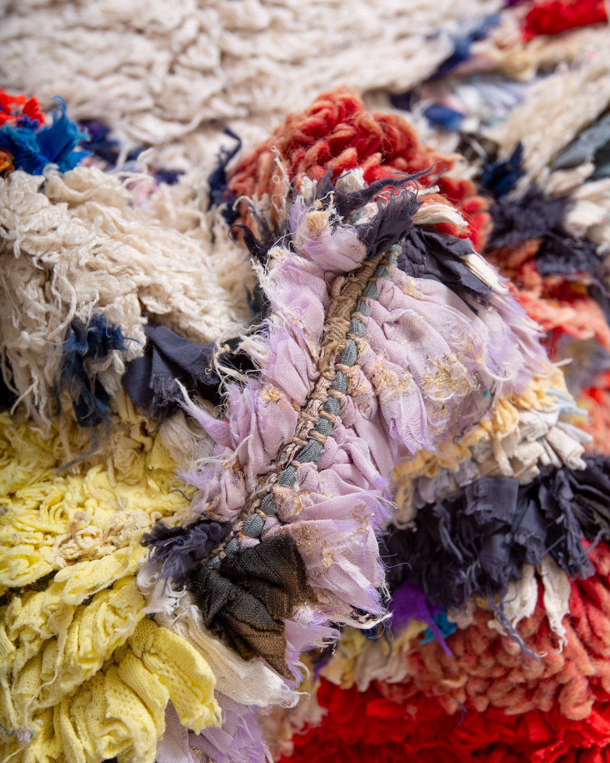 Modern designer vintage handcrafted Berber rug from Morocco. Boucherouite runner rug with beautiful colors and patterns.