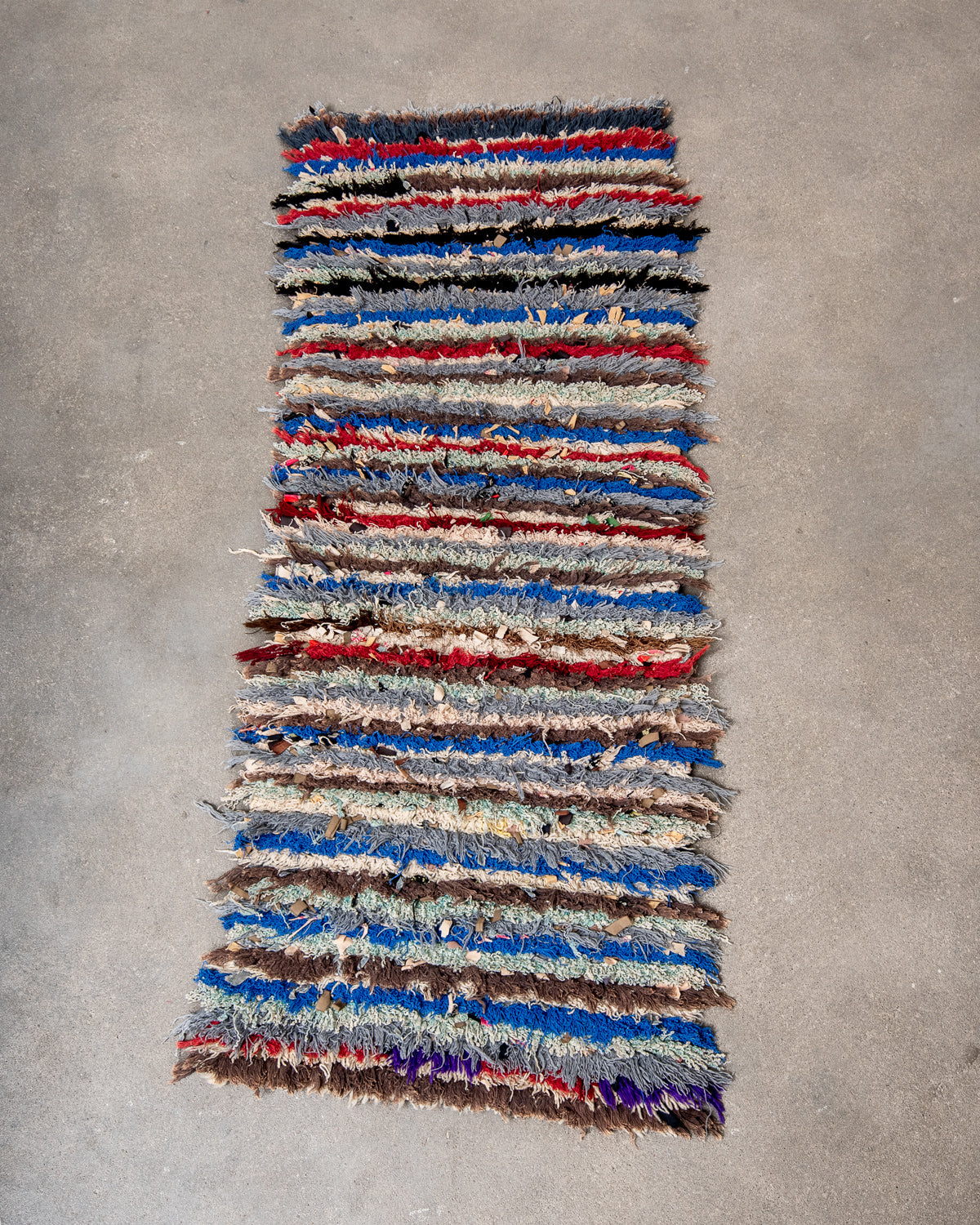 Modern designer vintage handcrafted Berber rug from Morocco. Boucherouite runner rug with beautiful colors and patterns.