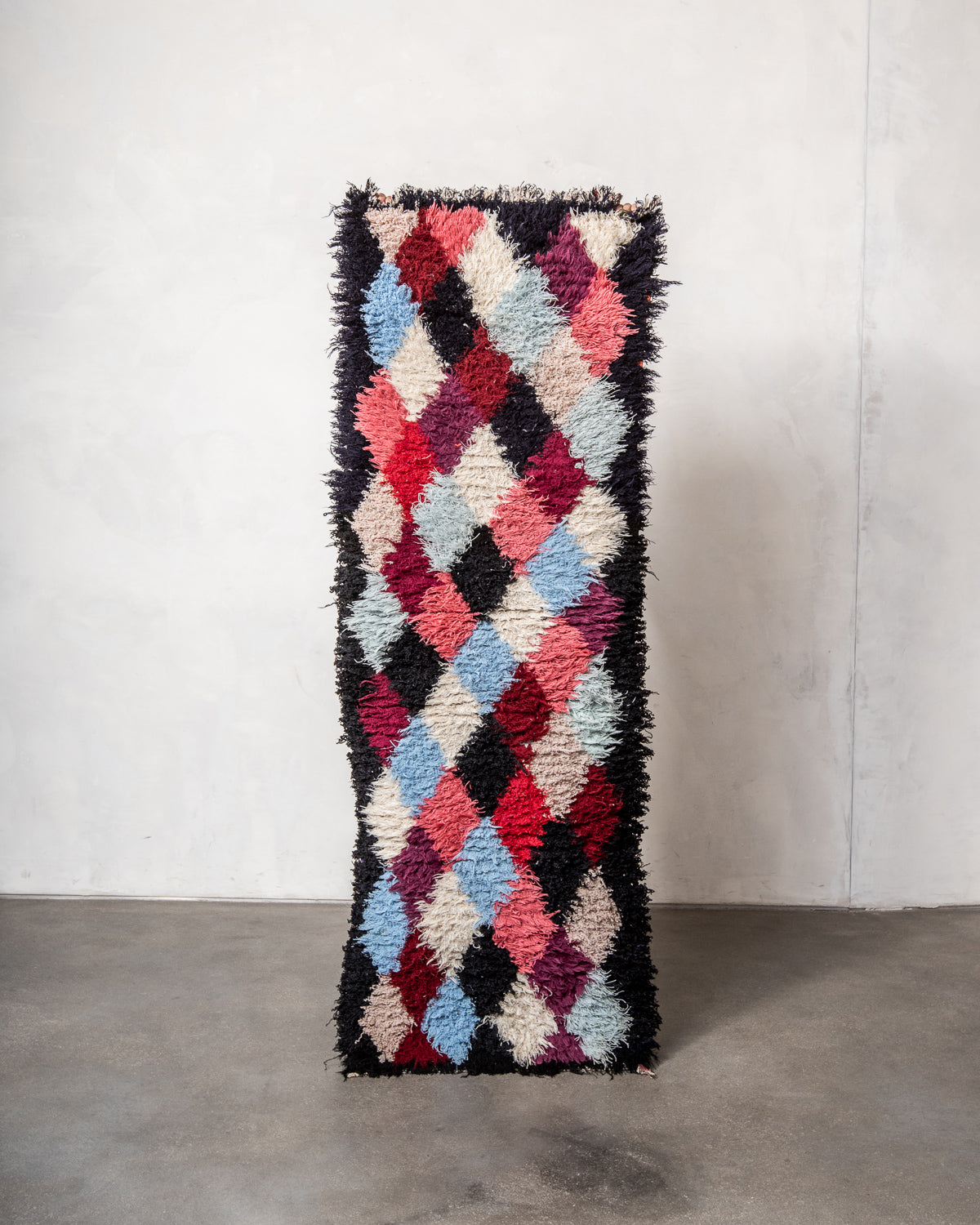 Modern designer vintage handcrafted Berber rug from Morocco. Boucherouite runner rug with beautiful colors and patterns.