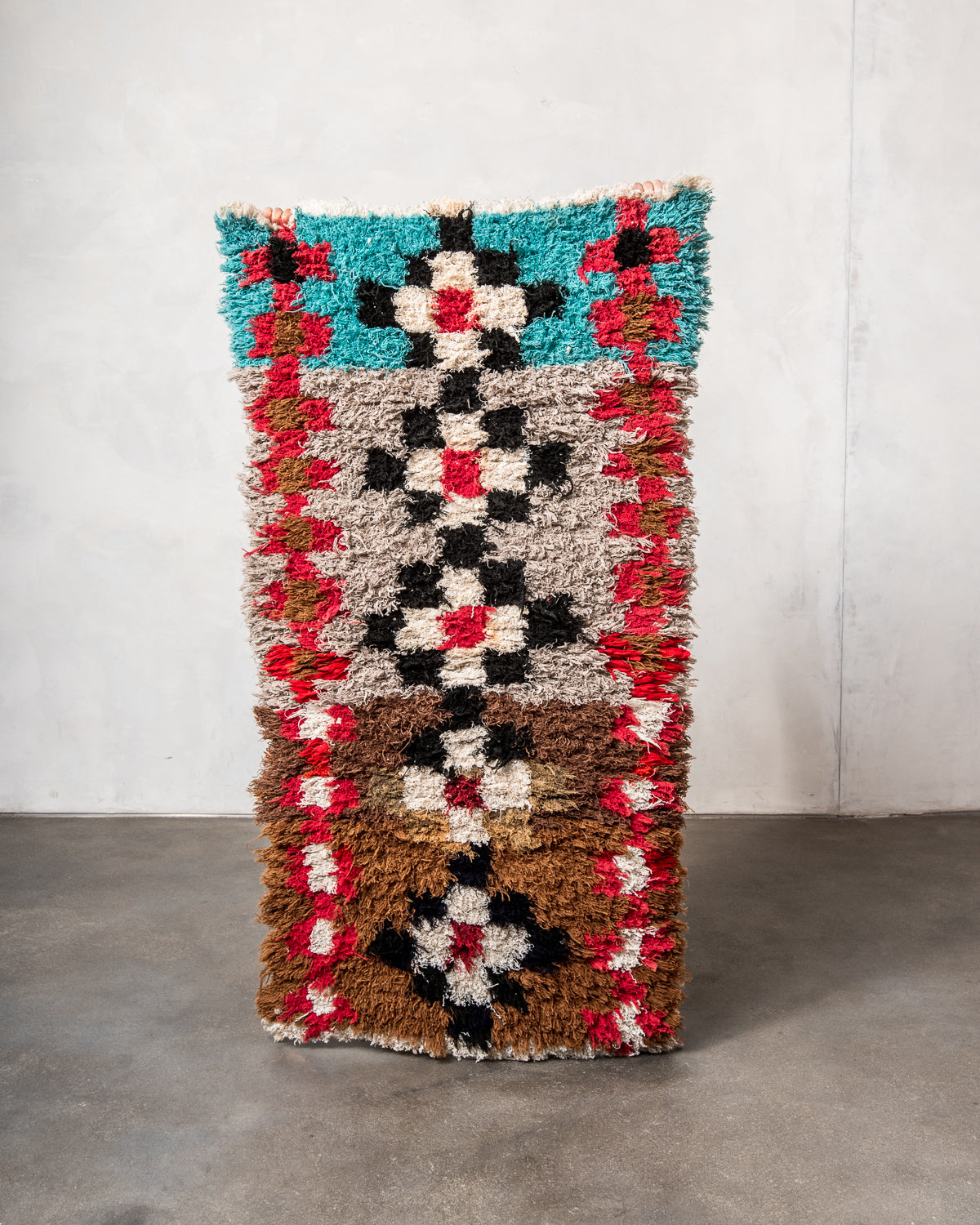 Modern designer vintage handcrafted Berber rug from Morocco. Boucherouite runner rug with beautiful colors and patterns.