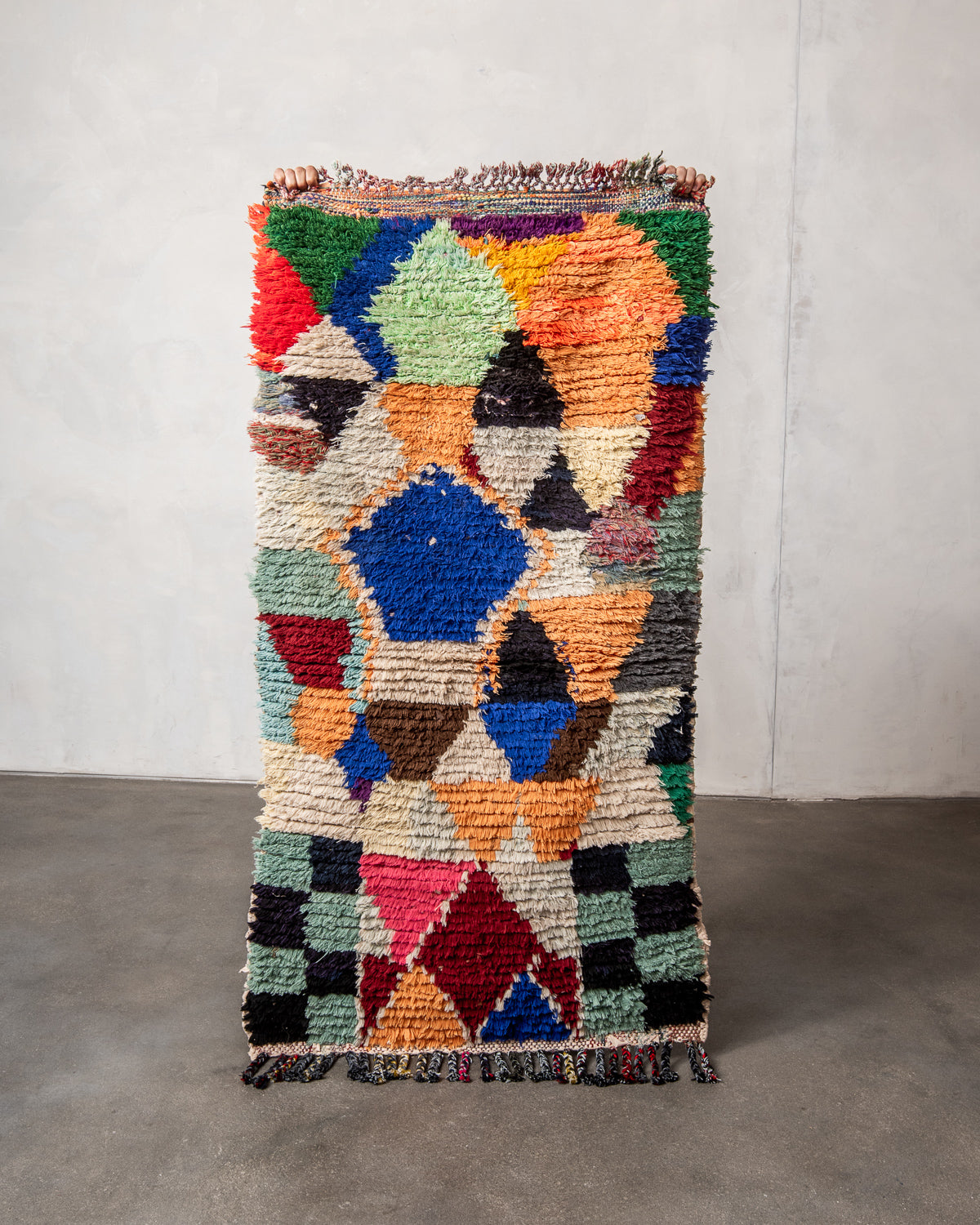 Modern designer vintage handcrafted Berber rug from Morocco. Boucherouite runner rug with beautiful colors and patterns.