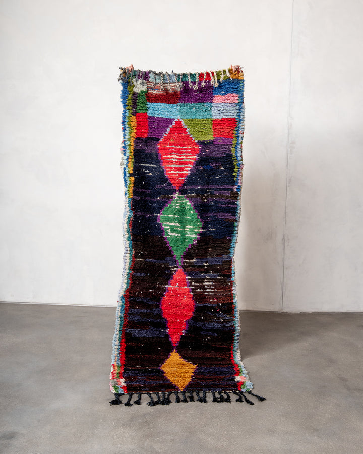 Modern designer vintage handcrafted Berber rug from Morocco. Boucherouite runner rug with beautiful colors and patterns.