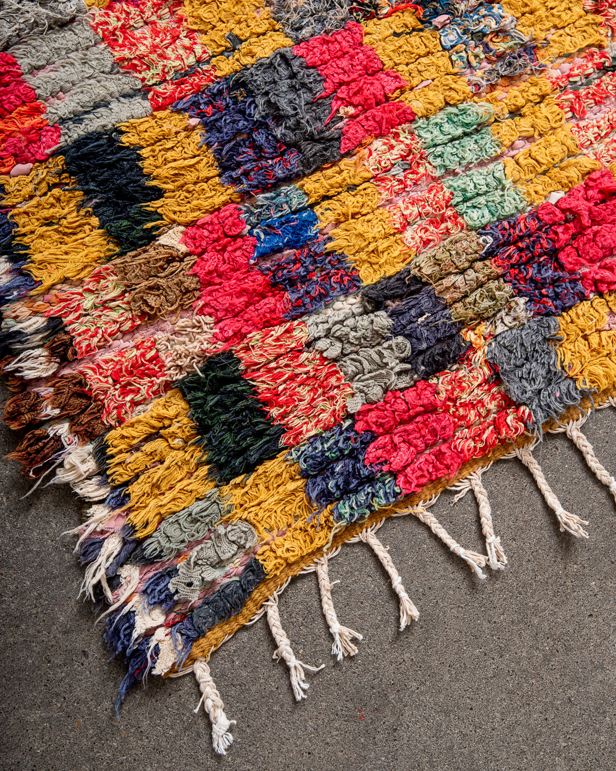 Modern designer vintage handcrafted Berber rug from Morocco. Boucherouite runner rug with beautiful colors and patterns.