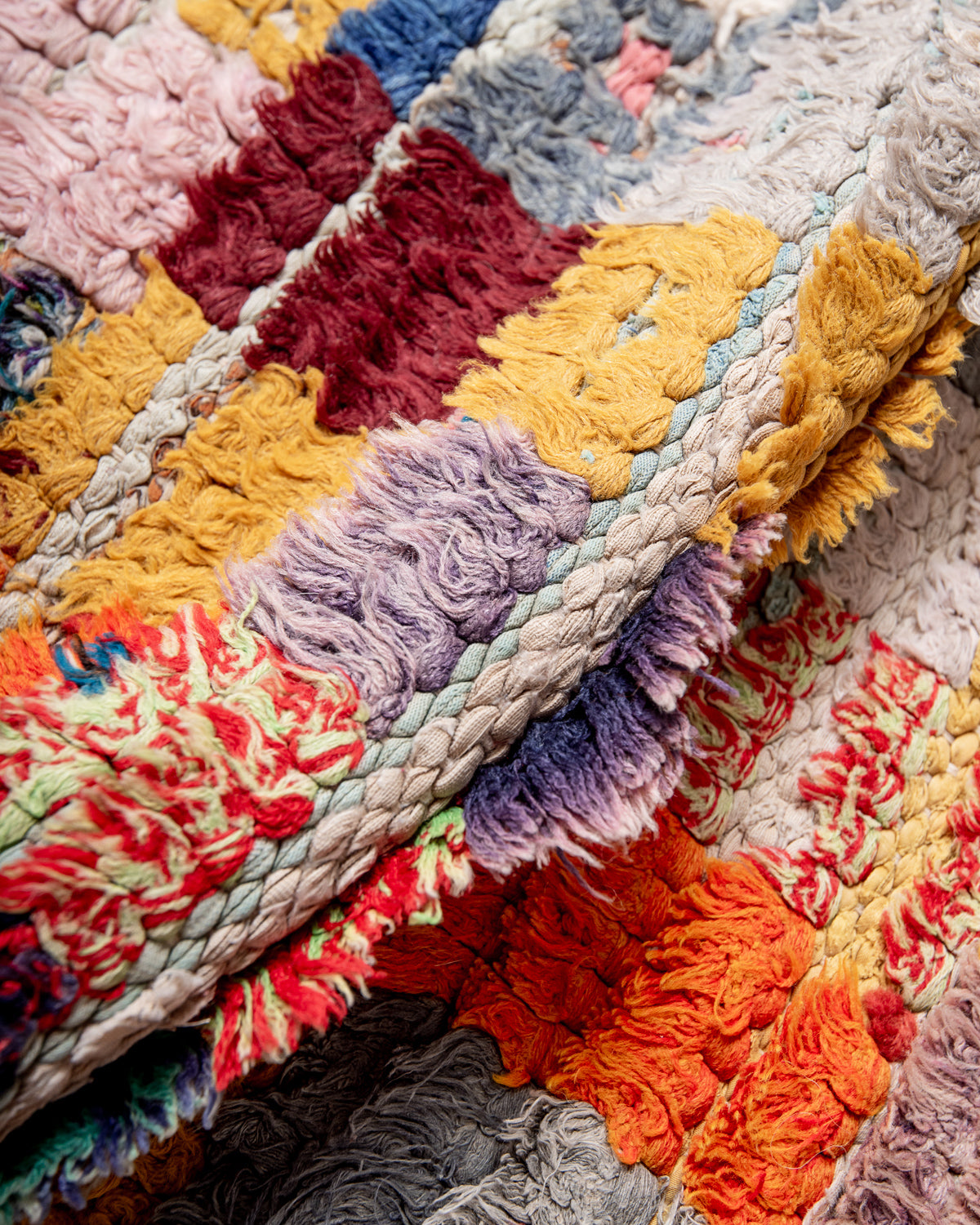 Modern designer vintage handcrafted Berber rug from Morocco. Boucherouite runner rug with beautiful colors and patterns.