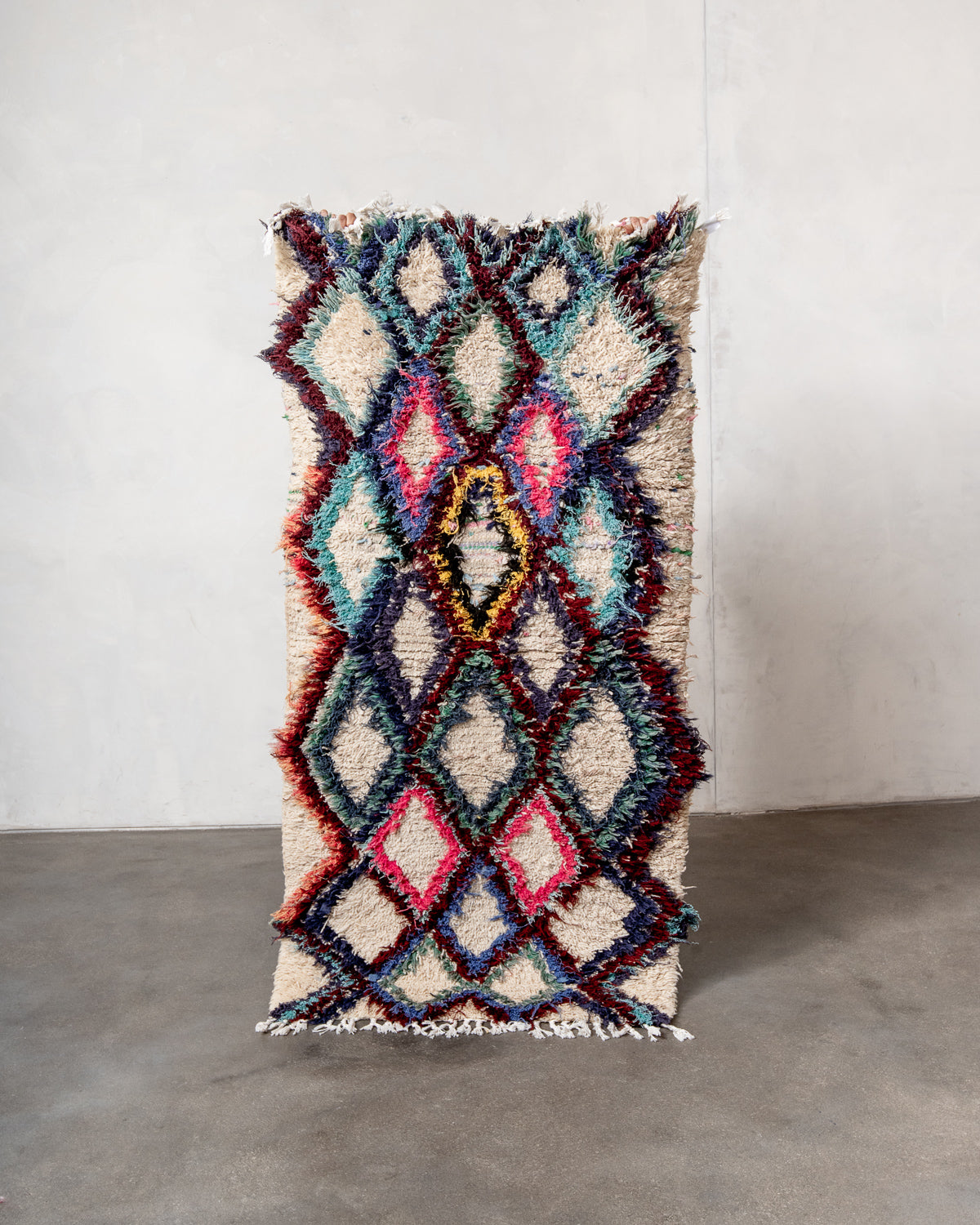 Modern designer vintage handcrafted Berber rug from Morocco. Boucherouite runner rug with beautiful colors and patterns.