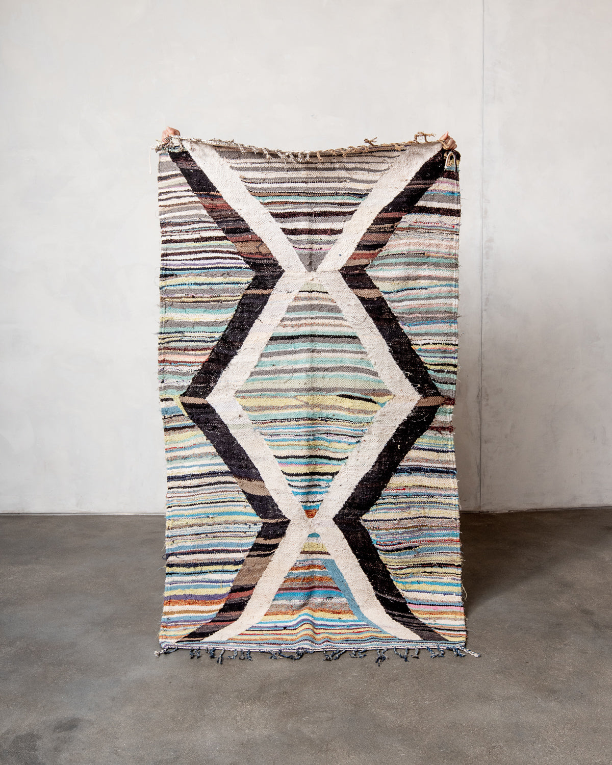 Modern designer vintage handcrafted Berber rug from Morocco. Boucherouite runner rug with beautiful colors and patterns.