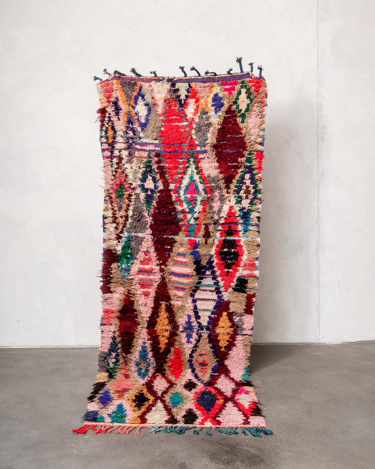 Modern designer vintage handcrafted Berber rug from Morocco. Boucherouite runner rug with beautiful colors and patterns.