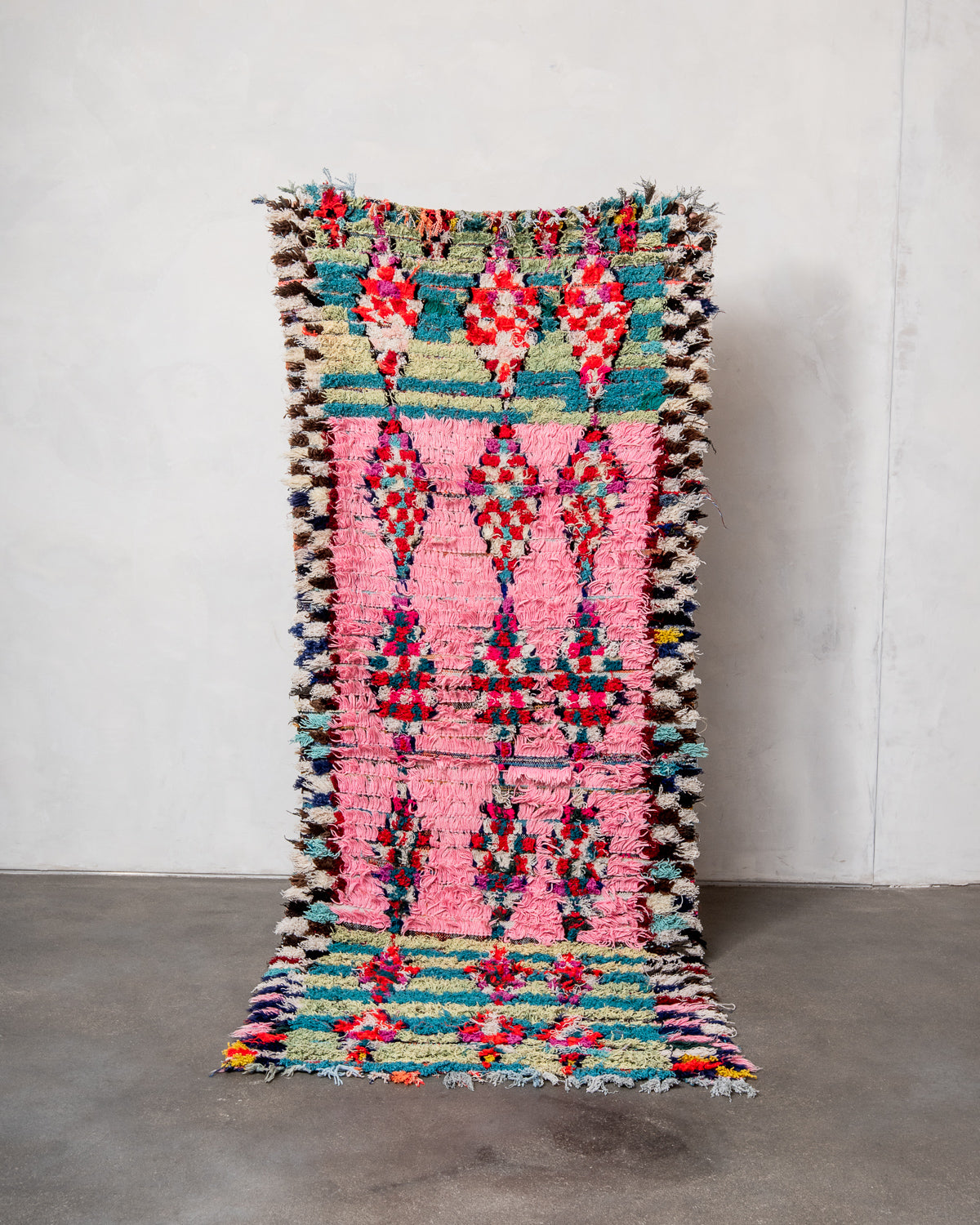 Modern designer vintage handcrafted Berber rug from Morocco. Boucherouite runner rug with beautiful colors and patterns.