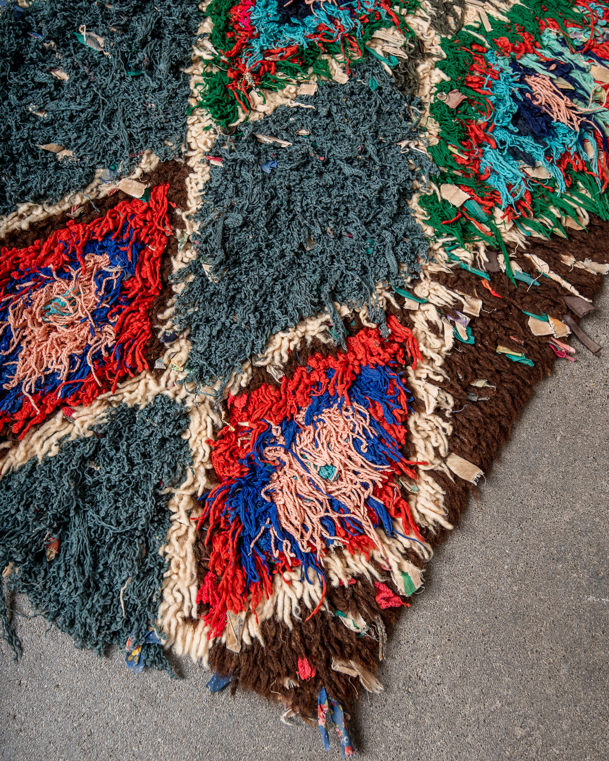 Modern designer vintage handcrafted Berber rug from Morocco. Boucherouite runner rug with beautiful colors and patterns.