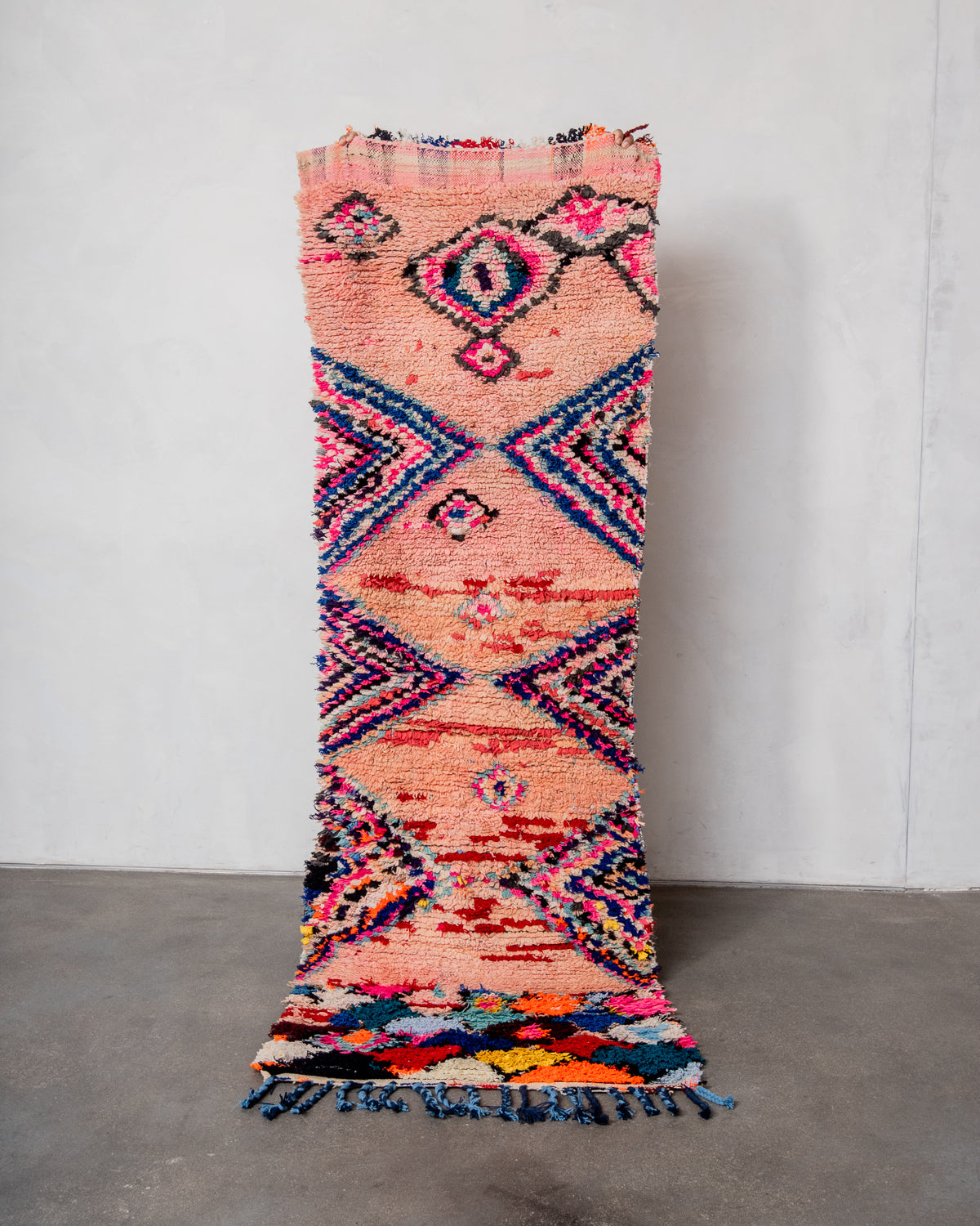 Modern designer vintage handcrafted Berber rug from Morocco. Boucherouite runner rug with beautiful colors and patterns.