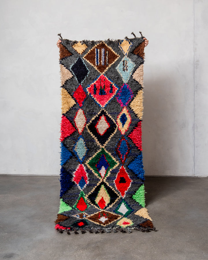 Modern designer vintage handcrafted Berber rug from Morocco. Boucherouite runner rug with beautiful colors and patterns.