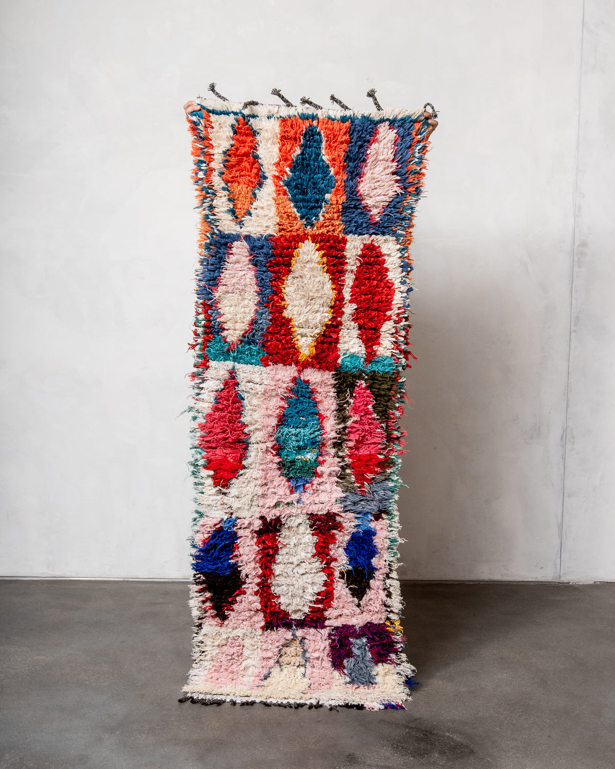 Modern designer vintage handcrafted Berber rug from Morocco. Boucherouite runner rug with beautiful colors and patterns.