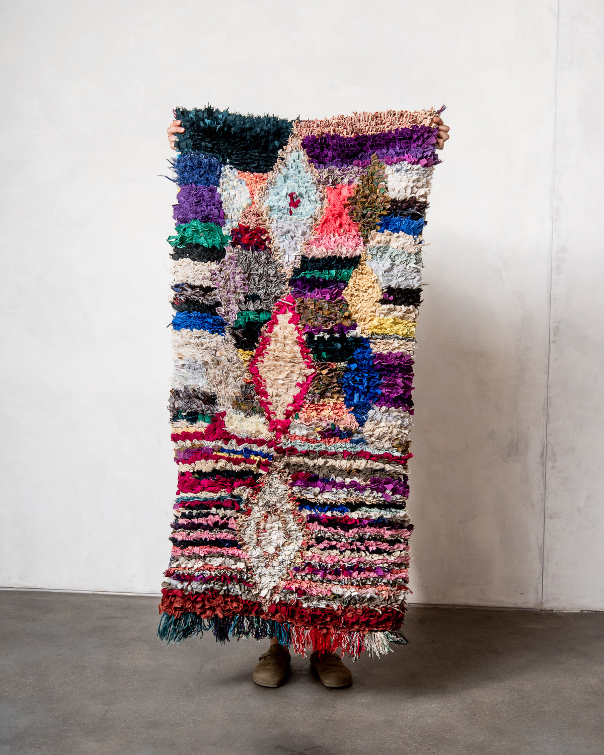 Modern designer vintage handcrafted Berber rug from Morocco. Boucherouite runner rug with beautiful colors and patterns.