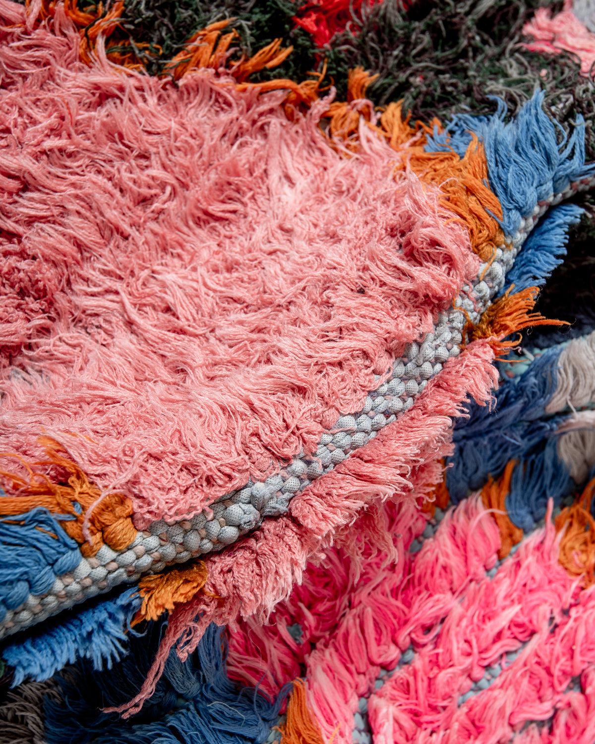 Modern designer vintage handcrafted Berber rug from Morocco. Boucherouite runner rug with beautiful colors and patterns.