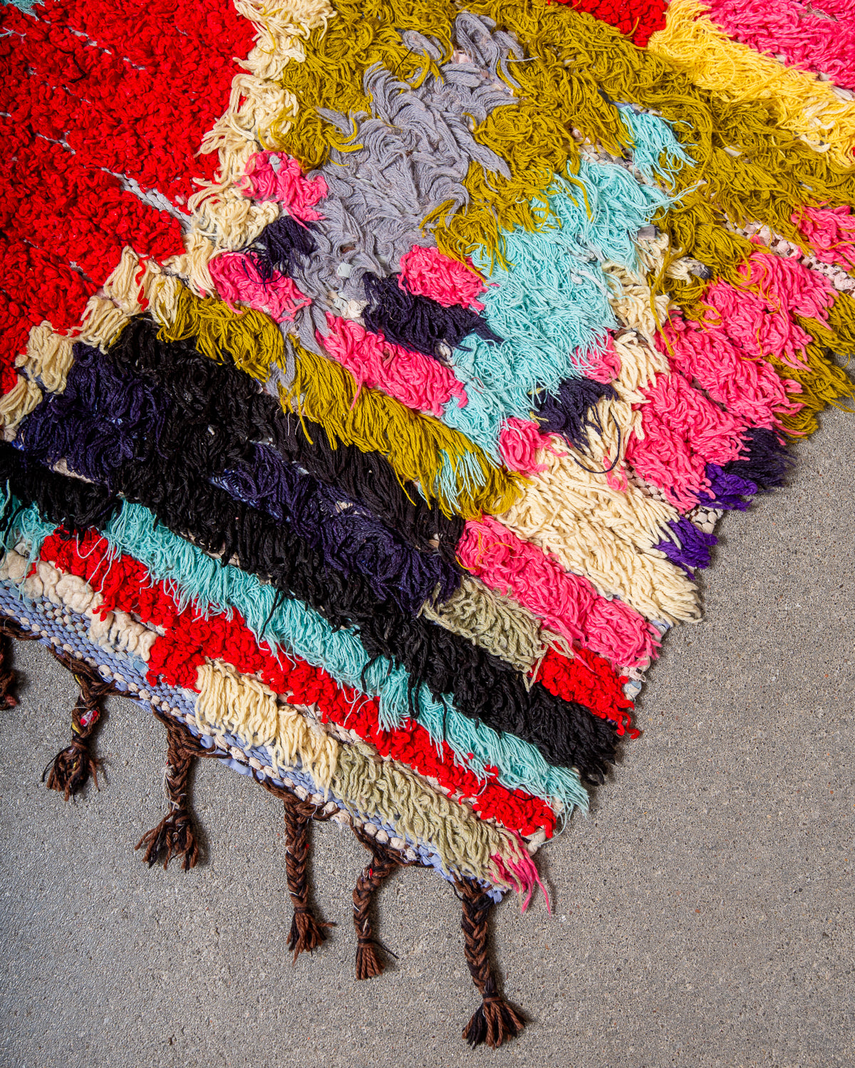 Modern designer vintage handcrafted Berber rug from Morocco. Boucherouite runner rug with beautiful colors and patterns.