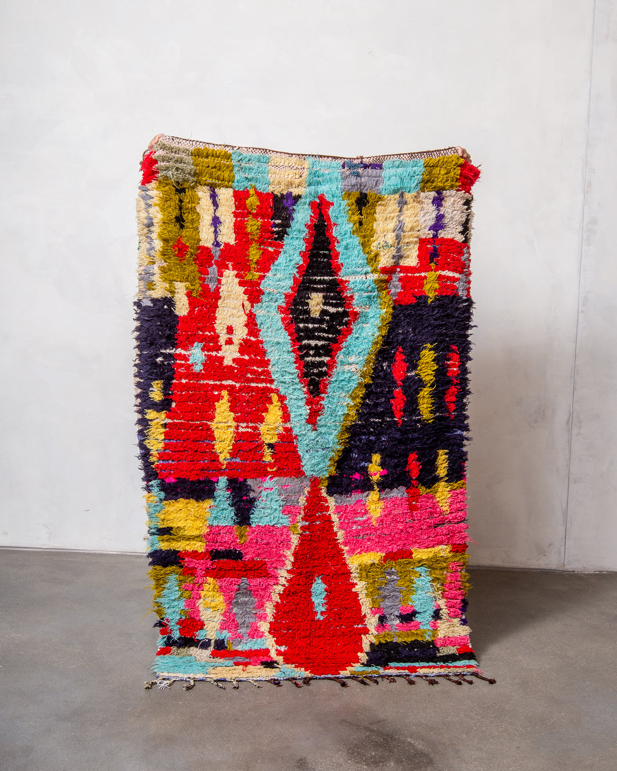 Modern designer vintage handcrafted Berber rug from Morocco. Boucherouite runner rug with beautiful colors and patterns.