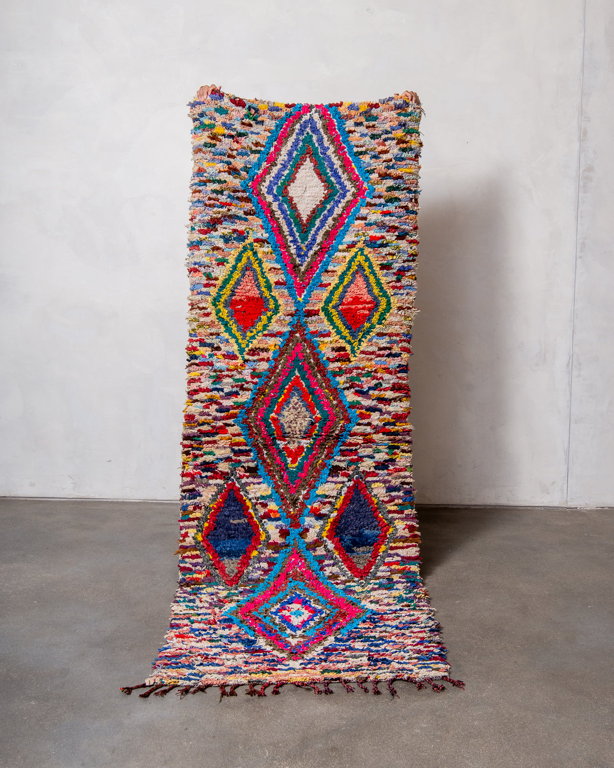 Modern designer vintage handcrafted Berber rug from Morocco. Boucherouite runner rug with beautiful colors and patterns.
