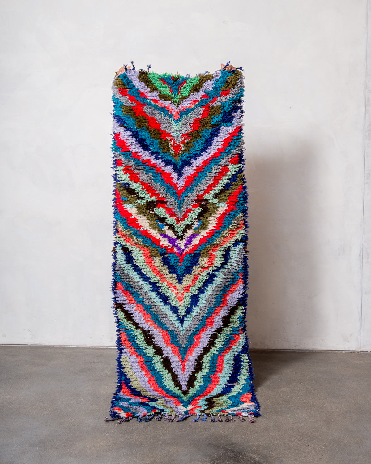 Modern designer vintage handcrafted Berber rug from Morocco. Boucherouite runner rug with beautiful colors and patterns.