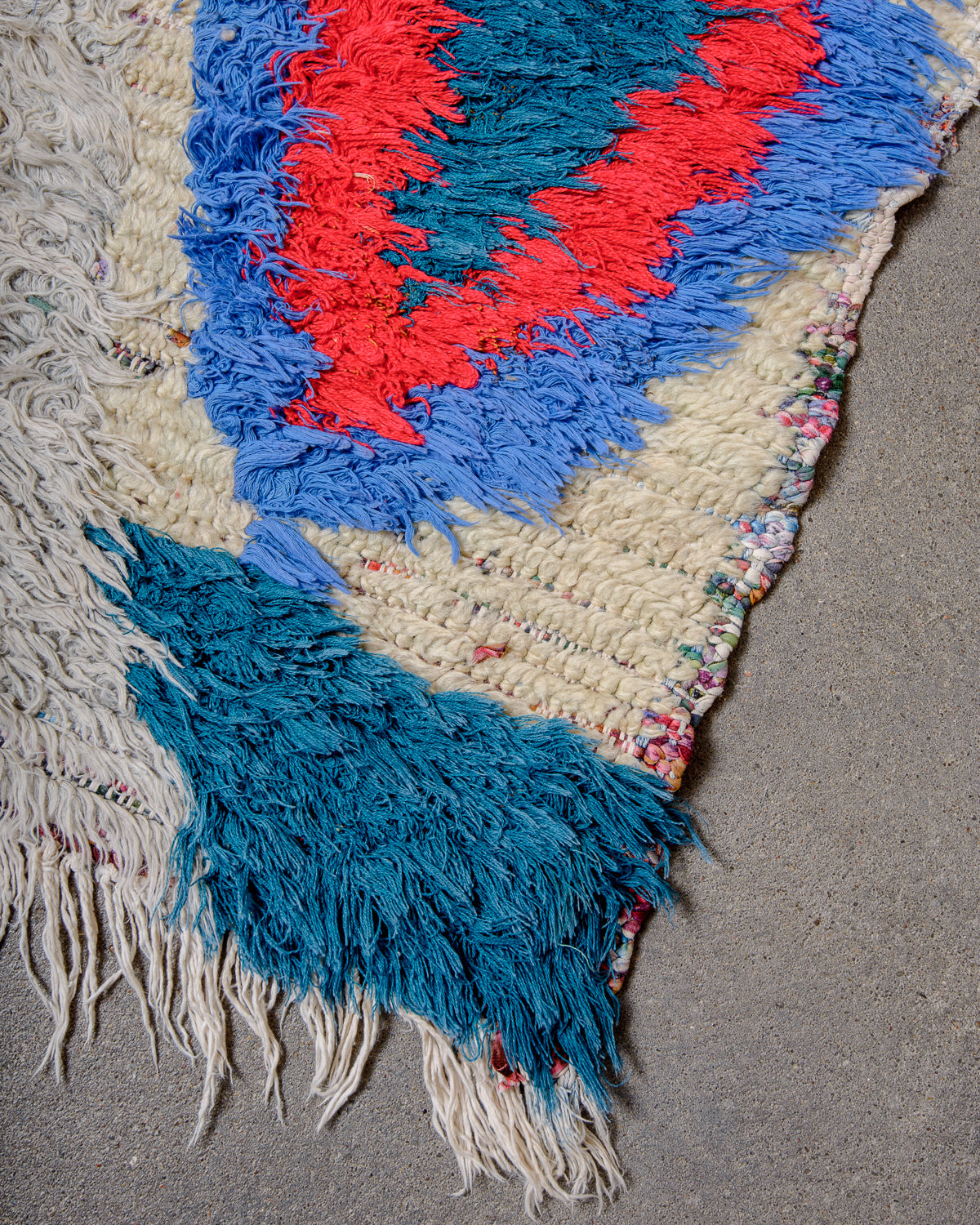 Modern designer vintage handcrafted Berber rug from Morocco. Boucherouite runner rug with beautiful colors and patterns.