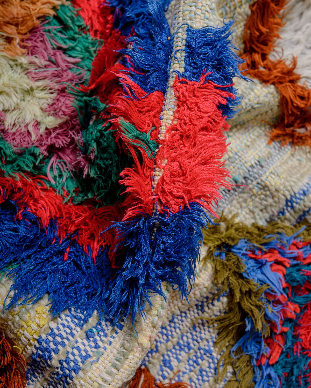 Modern designer vintage handcrafted Berber rug from Morocco. Boucherouite runner rug with beautiful colors and patterns.